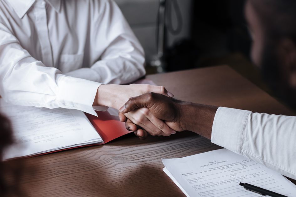 A diverse handshake over a business agreement