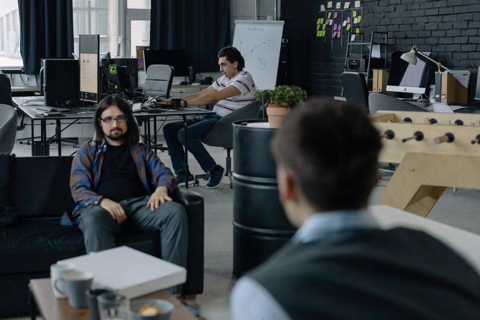 Three men working together in an office setting