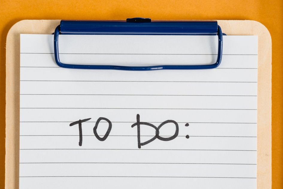 A clean to-do list on a clipboard with lined paper