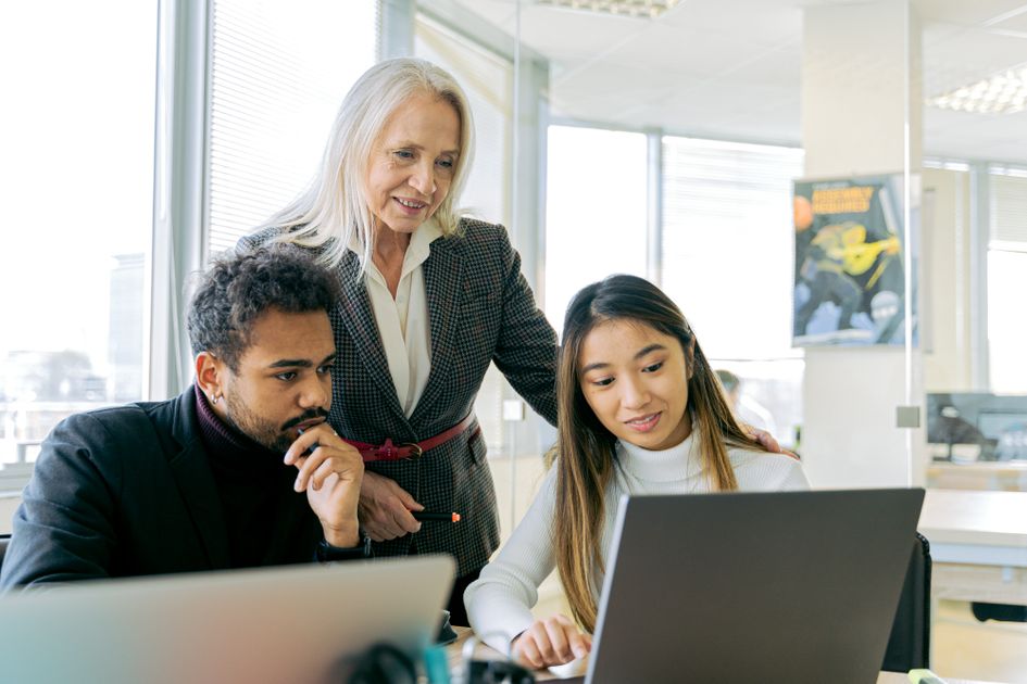 A diverse group of professionals in a collaborative office meeting