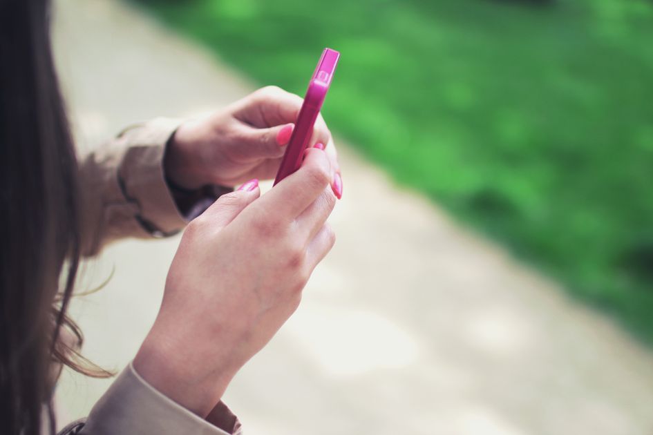 A person holding a smartphone with both hands