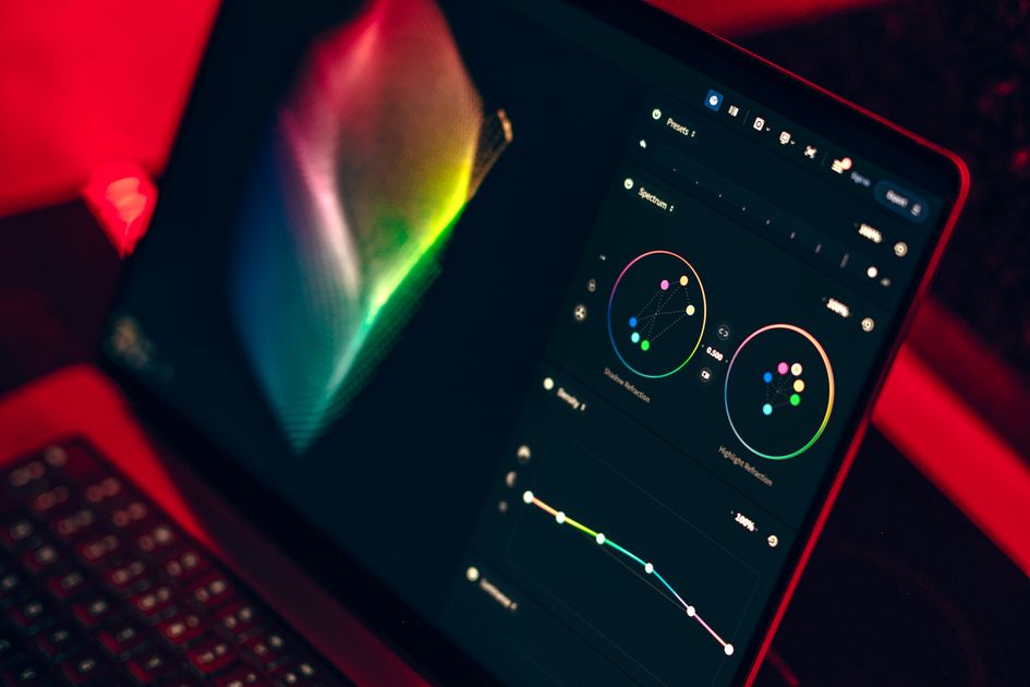 A laptop displaying a colorful dashboard interface