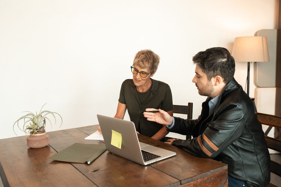 A diverse group of professionals engaged in a collaborative office meeting