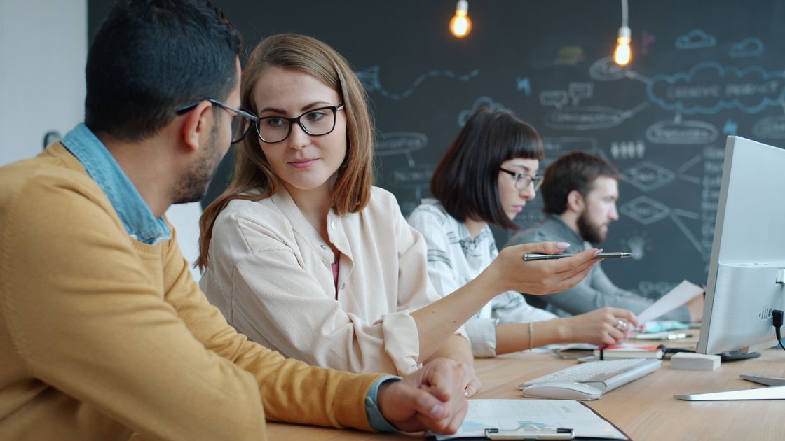 A group of professionals collaborating in a modern workspace