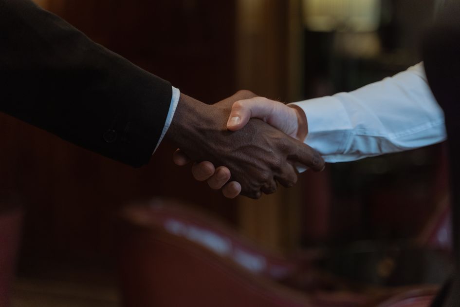 A close-up handshake representing a clear agreement
