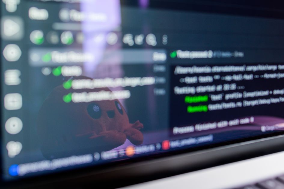 A laptop screen displaying programming code