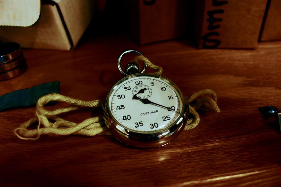 A smartphone displaying a stopwatch on a marble surface