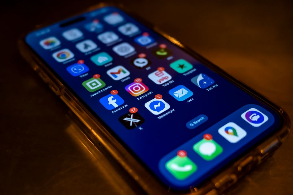 A smartphone screen crowded with social media notifications