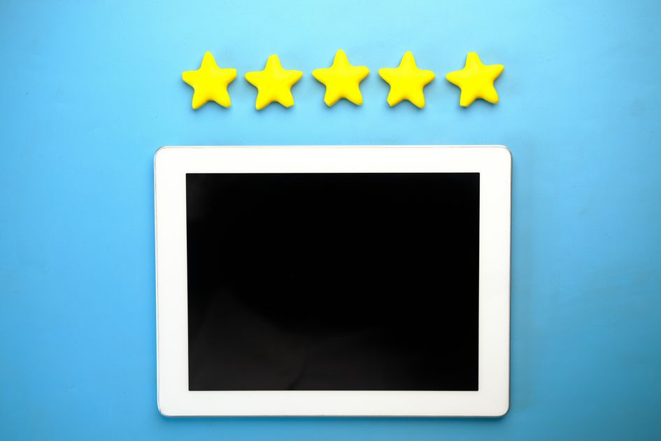 A tablet displaying a five-star rating