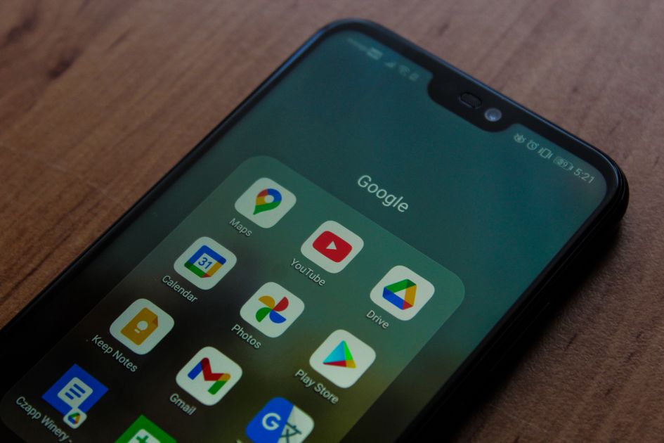 A smartphone showing various apps on its screen