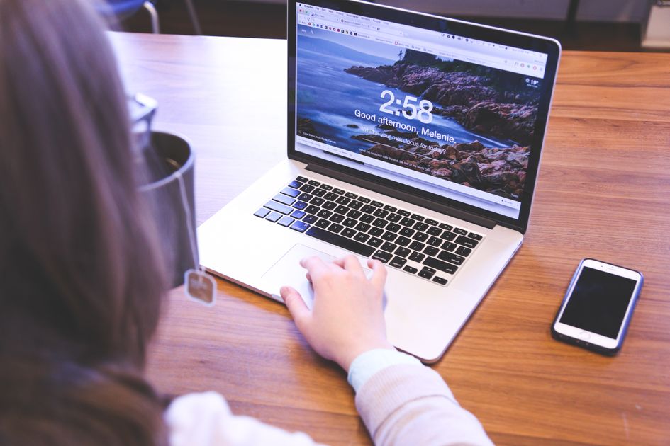 A person using a laptop with a browser open