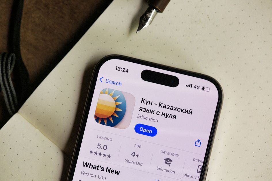 A smartphone screen showing a rating app in a notebook setting