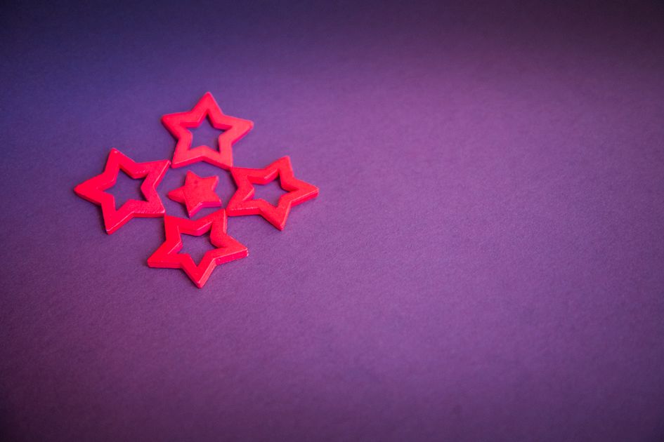 Vibrant star-shaped cutouts on a purple background