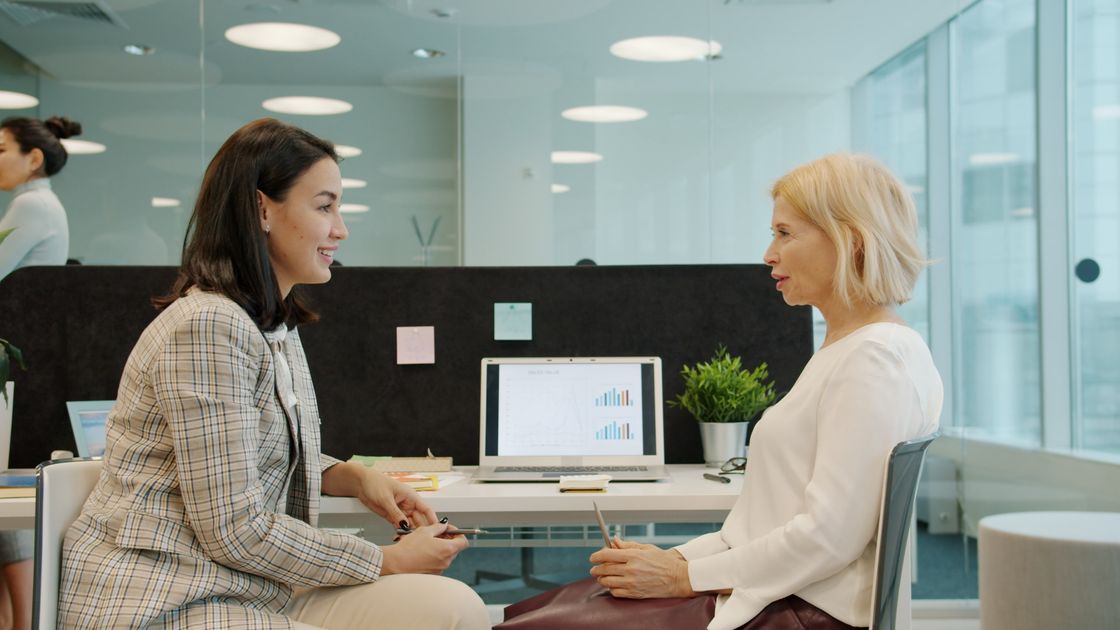 Professional women engaged in a business discussion