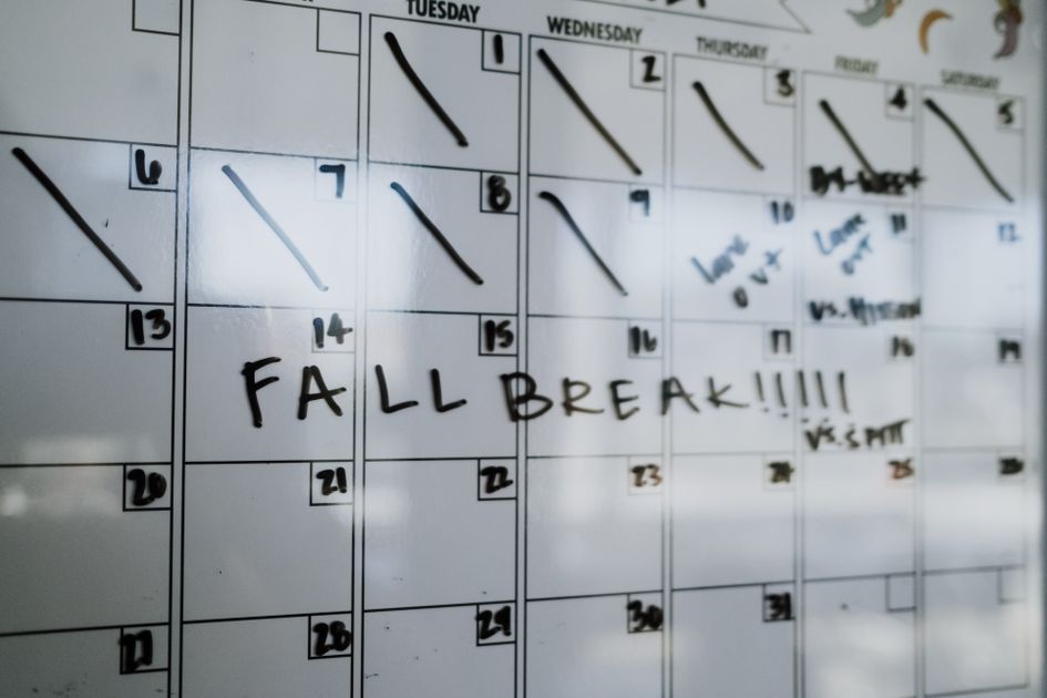 A whiteboard calendar with bold lettering