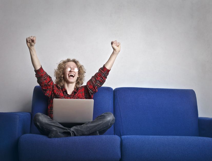 A fast-paced office environment with someone multitasking on a computer