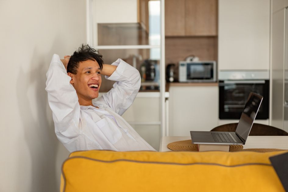 A real estate professional reviewing property listings on a tablet