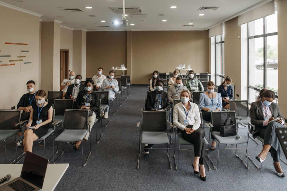 Attendees seated together during a business meeting