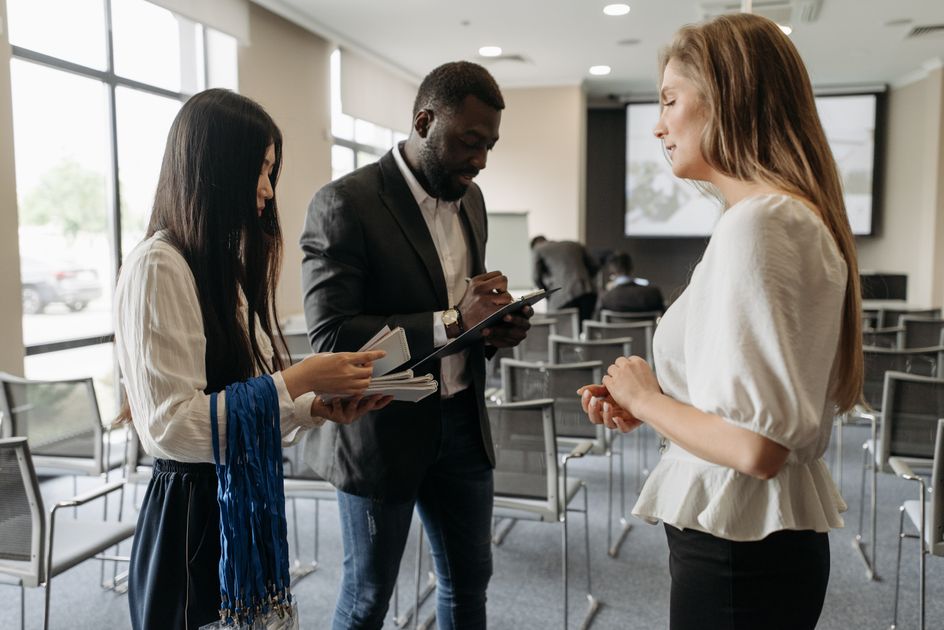 A diverse group discussing strategy in a modern conference room
