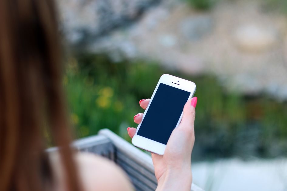 A woman using a smartphone outdoors