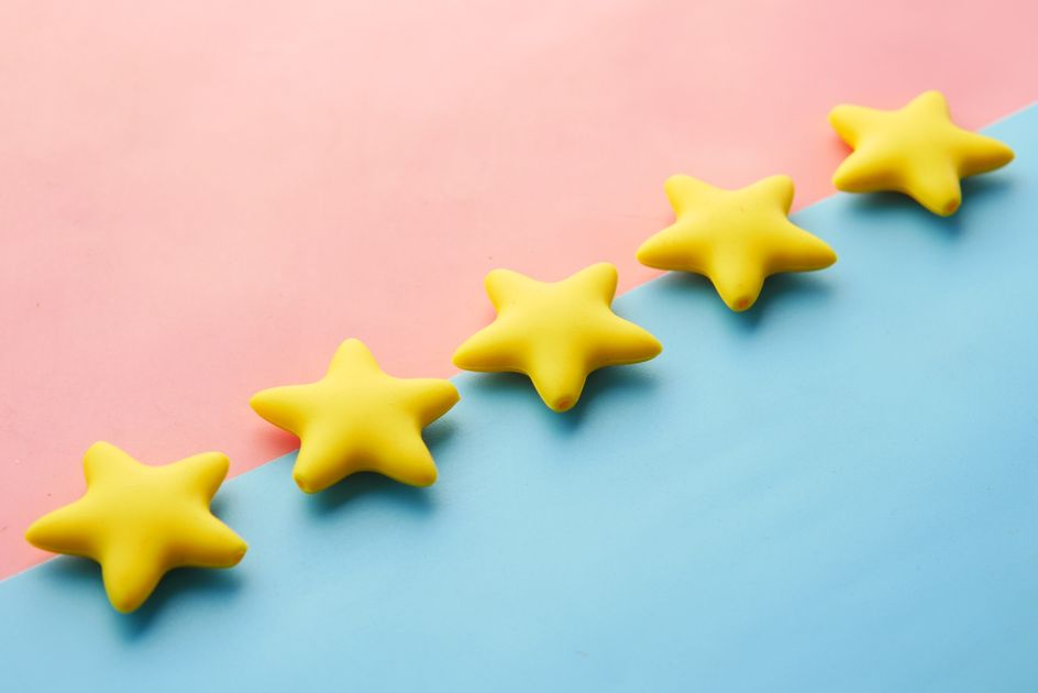 Yellow stars on a pastel background for a rating concept